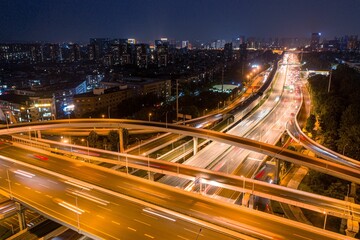 Aerial shot of Wuhan Optics Valley Avenue overpass during evening peak hours.
