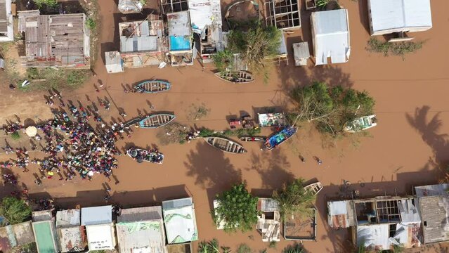 Aerial of the poor population of Africa with boats and old buildings during the flood