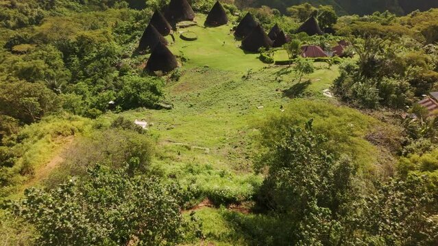 Aerial view of traditional village with mountain and forest in Wae Rebo, Flores, Indonesia.