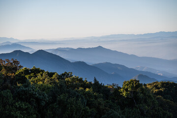  beautiful view of mountain with clouds at sunrise (Doi Inthanon National Park, Chiang Mai), soft focus