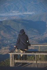 tourist taking photo on view point (Kew Mae Pan Nature Trail, Chiang Mai), soft focus