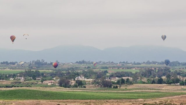 Temecula Balloon and Wine Festival Six Balloons Drone Movement Sideways to Left Paraglider Enters From Left
