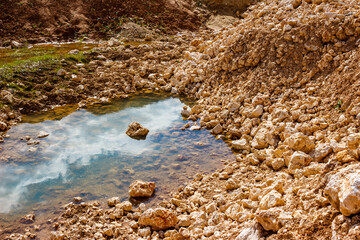 Accumulated water at the bottom of a limestone quarry