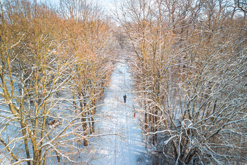 Person walking on snow, in giessen, germany