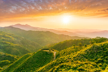 summer scenery mountain view from a highland hill to a beautiful sunset.