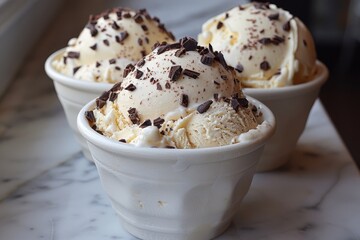 Stracciatella Gelato: Creamy gelato with fine chocolate shavings throughout, served in a bowl or cone. 