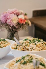 Bowls filled with delicious food, accompanied by a beautiful floral background