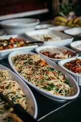 Pasta dish with assorted vegetables elegantly plated for a wedding reception