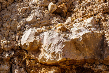Cream-colored marble-like limestone in a geological outcrop. Lower Carboniferous, Russia