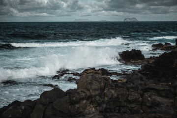 Fototapeta premium Ocean wave breaks in lava coastline, Lanzarote