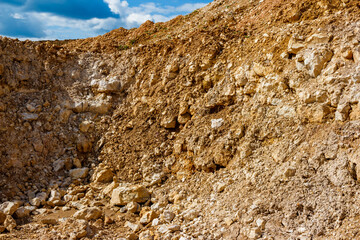 Background with a view of crumbling stones at a crushed stone quarry