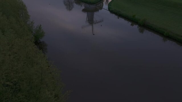 Aerial view of De Vlinder windmill, river Linge, and sunrise, Deil, Gelderland, Netherlands.