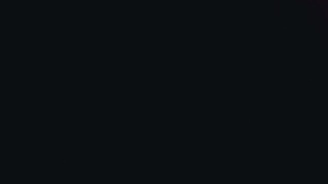 Animated abstract illustration of soft blurry gradient colors on dark backdrop