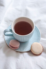 Plate with macarons and a cup of tea