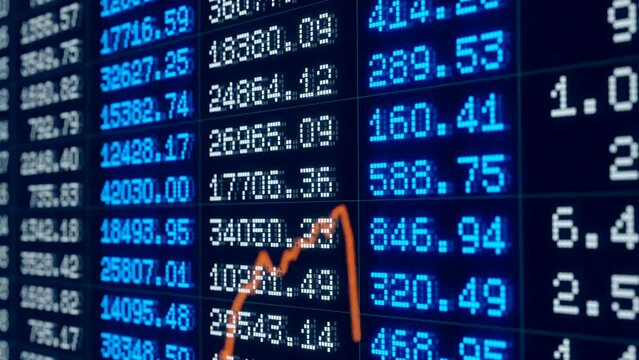 Financial report, statistic or corporate information. Changing numbers, financial figures, business data. Orange chart reflection in the screen.