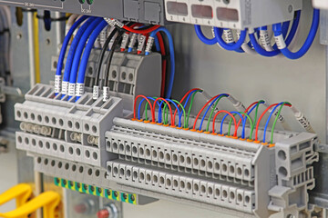 Electrical terminals with screw connection of copper electrical wires. Close-up.