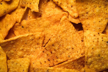 close up of corn tortilla chips snack. food background.