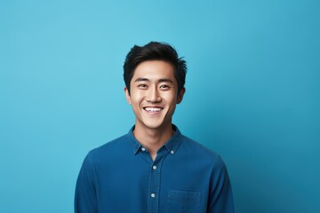 Blue Background Happy asian man realistic person portrait of young teenage beautiful Smiling boy good mood Isolated on Background ethnic diversity equality acceptance