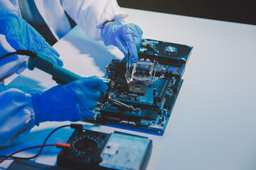 Close up of Technician measuring voltage electronic circuit board television, Service after sale fix electric equipment within insurance.