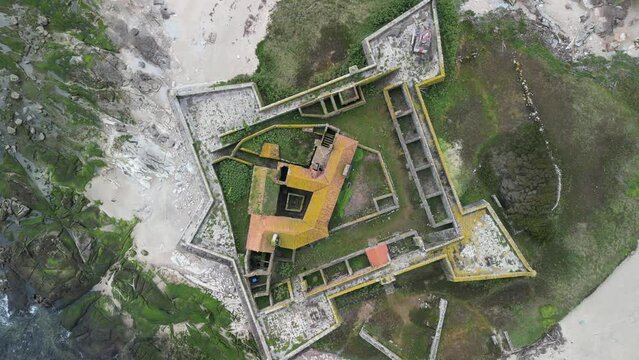 Aerial view of historic fortress overlooking coastline and ocean at Forte da Insua, Caminha, Viana do Castelo, Portugal.