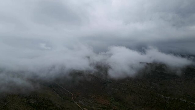 Aerial view of misty mountain range in Drie Kuilen Nature Reserve, Western Cape, South Africa.