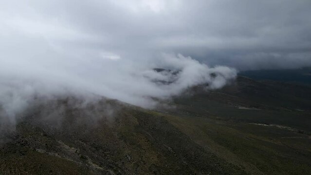 Aerial view of rugged mountain landscape with low cloud and mist, Drie Kuilen Nature Reserve, Western Cape, South Africa.