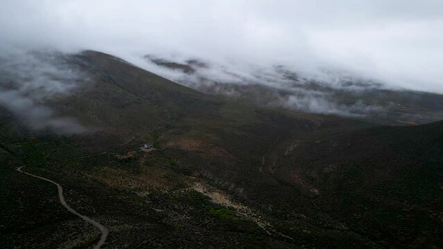 Aerial view of foggy mountain landscape with low cloud, Drie Kuilen, Western Cape, South Africa.