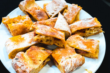Portuguese style empanada, traditional pie stuffed with meat typical of Portugal. Food photography concept