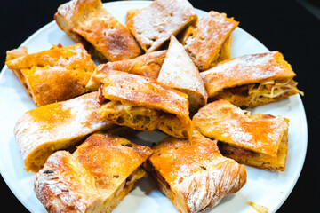 Portuguese style empanada, traditional pie stuffed with meat typical of Portugal. Food photography...