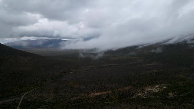 Aerial view of mountain peak with low cloud, Drie Kuilen, Western Cape, South Africa.