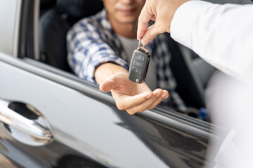 lease, rental car, sell, buy. Dealership manager send car keys to the new owner.  Sales, loan credit financial, rent vehicle, insurance,  renting, Seller, dealer, installment, car care business