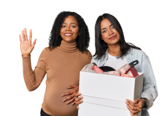 Latin women couple moving, one pregnant  smiling cheerful showing number five with fingers.