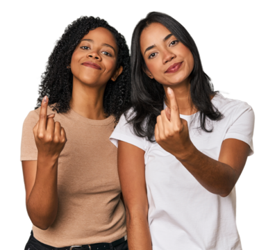 Young Latin friends in studio pointing with finger at you as if inviting come closer.