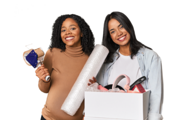 Two Latin women, one pregnant, with moving box in studio
