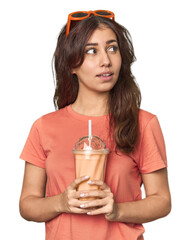 Young Middle Eastern woman with sunglasses, vanilla shake