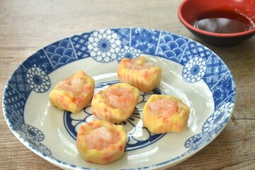 steamed chicken tendon with mashed pork topping shrimp or dim sum on plate dipping sour soy sauce  