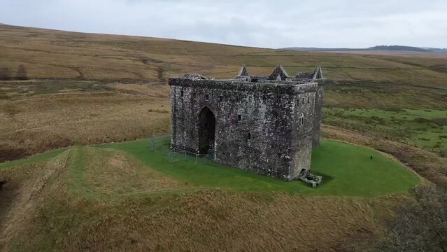 Drone footage of Hermitage Castle in the remote valley of the Hermitage Water, Scotland, UK