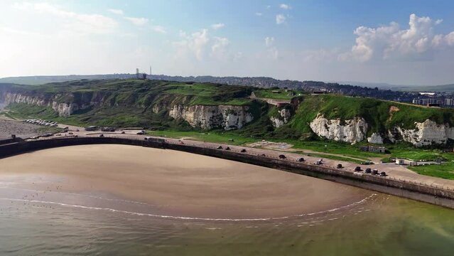 Drone footage over Newhaven, East Sussex England. West beach, fort, castle hill, town and ferry can all be seen.
