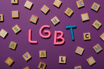 LGBT parade concept, compound word on purple background.