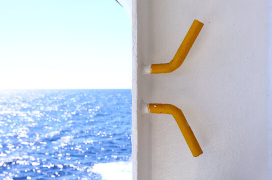 Yellow painted cleat on the deck of Cruise ship