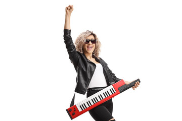 Fototapeta premium Happy female musician with a keytar wearing sunglasses and gesturing with hand
