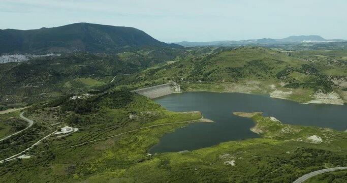 Aerial view of serene reservoir and mountain landscape, Embalse de Guadalteba, Andalusia, Spain.