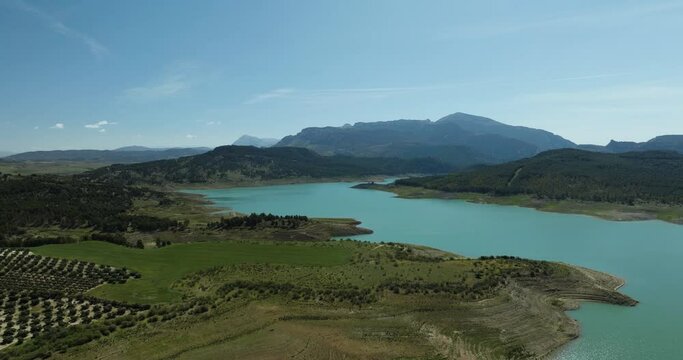 Aerial view of clear river mouth and manmade reservoir Embalse de Guadalteba, Campillos, Andalusia, Spain.