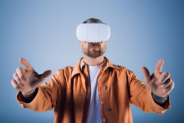 A man wearing a virtual reality headset is experiencing the world of the Metaverse in a studio setting.