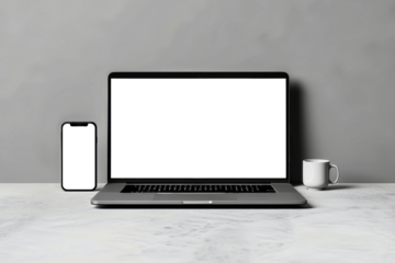 A laptop computer sits on a table next to a cup of coffee. Mockup for design. Isolated.