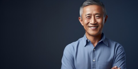 Navy Background Happy asian man. Portrait of older mid aged person beautiful Smiling boy good mood Isolated on Background ethnic diversity 
