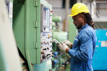 engineer or technician checking and control lathe machine in the factory