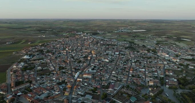 Aerial view of historic town with traditional rooftops and scenic sunset, San Clemente, Castilla - La Mancha, Spain.