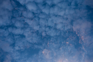 Bright sky texture background with white clouds, pleasing to the eye.