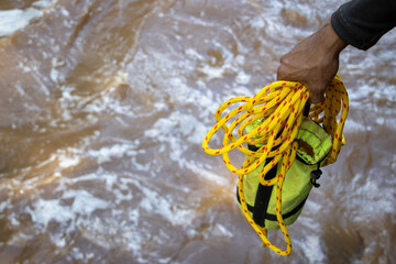 Selective focus yellow drawstring bag For helping victims of water disasters Help tourists go...